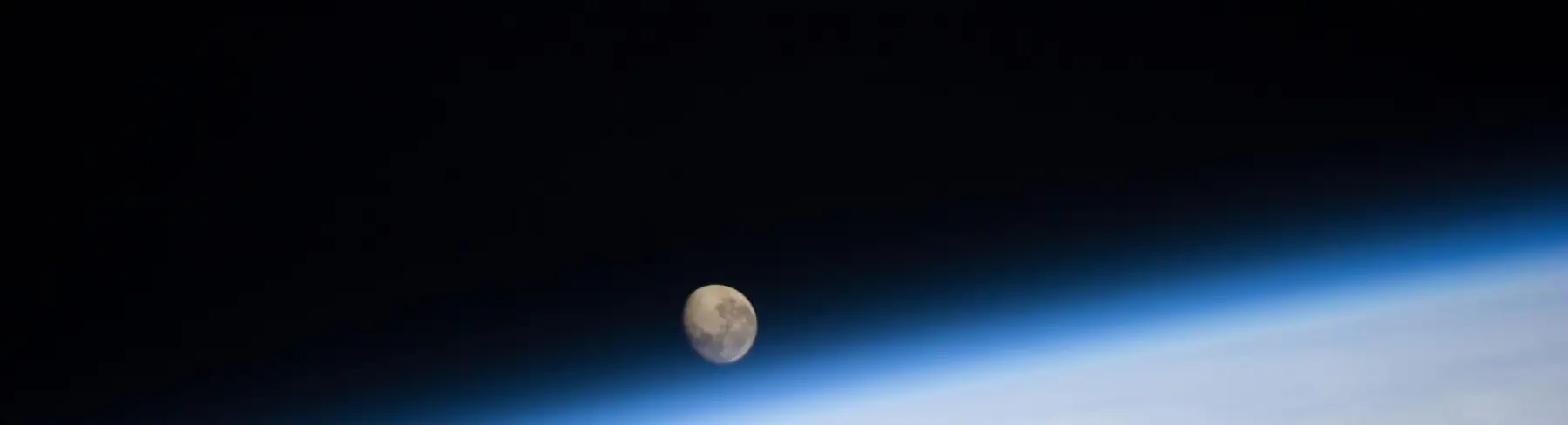 The Moon above Earth’s atmosphere, photographed from the International Space Station